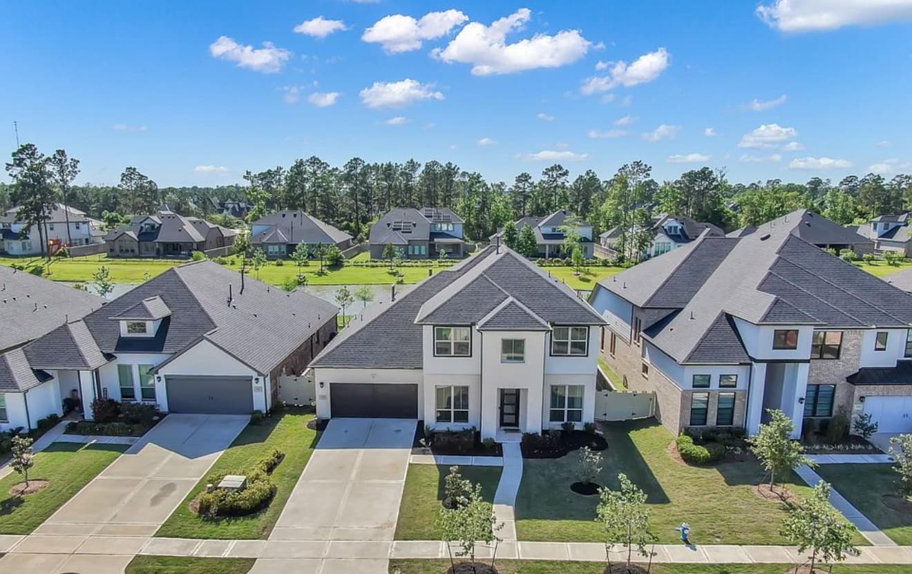 Aerial view of suburban neighborhood with single-family homes