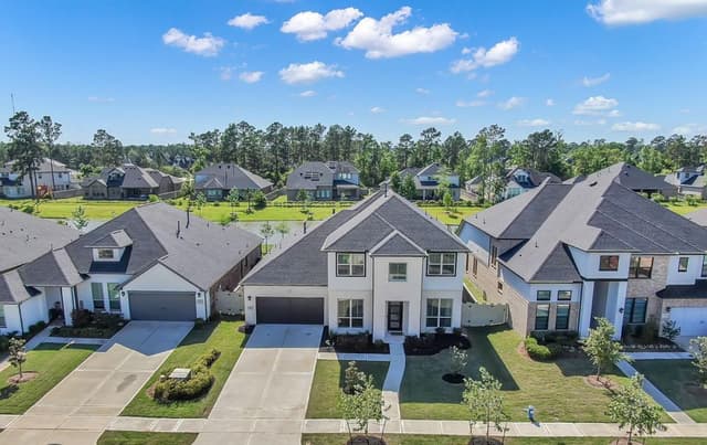 Aerial view of suburban neighborhood with single-family homes